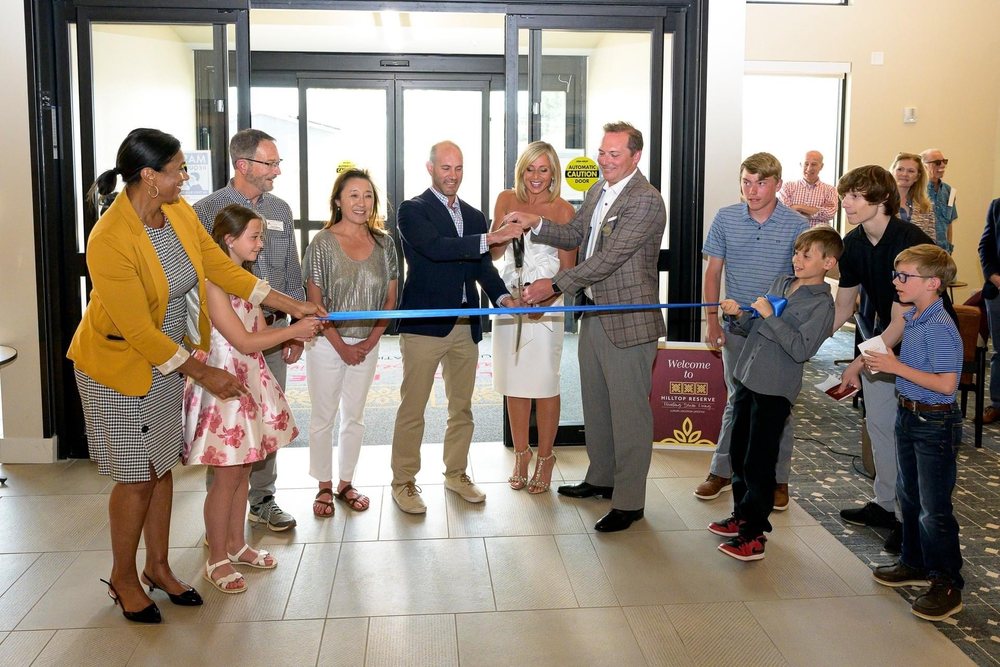 Tom and Susie Finley cutting the ribbon at the Hilltop Reserve opening